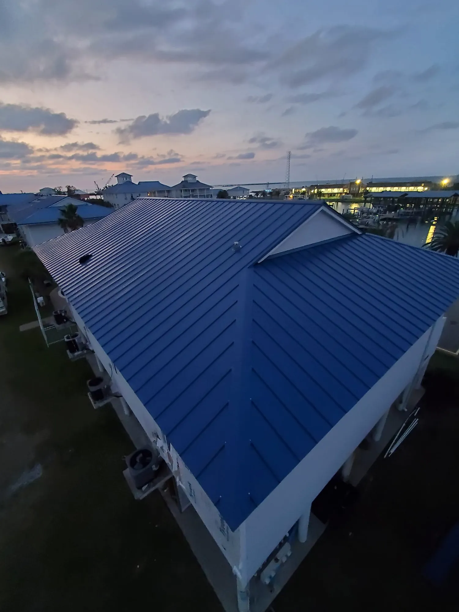 Standing-seam metal roof at dusk