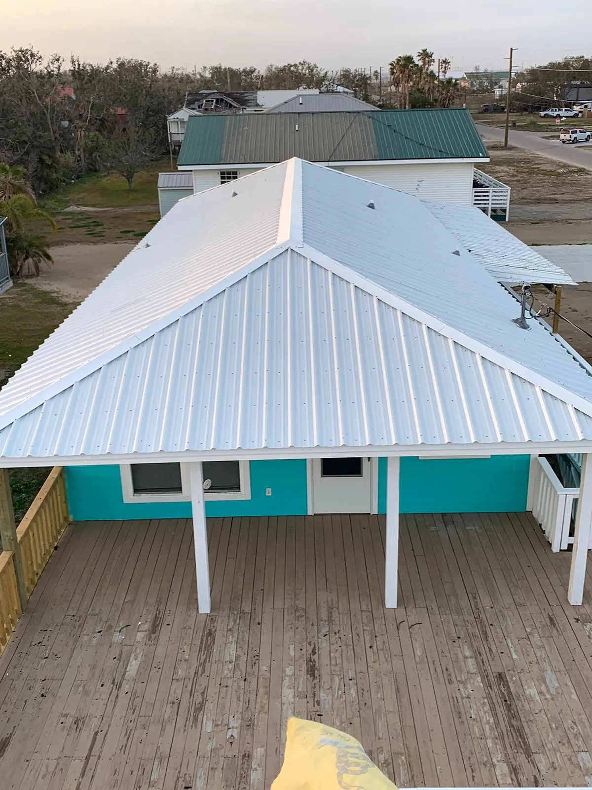 White metal roof on a raised cabin